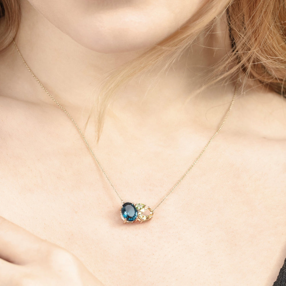 model wearing Teal Topaz Gold Cluster Necklace