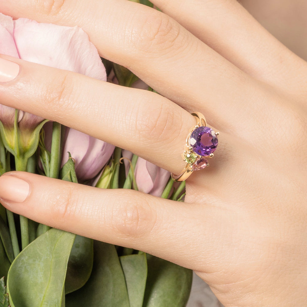 Model wearing purple amethyst gold cluster ring