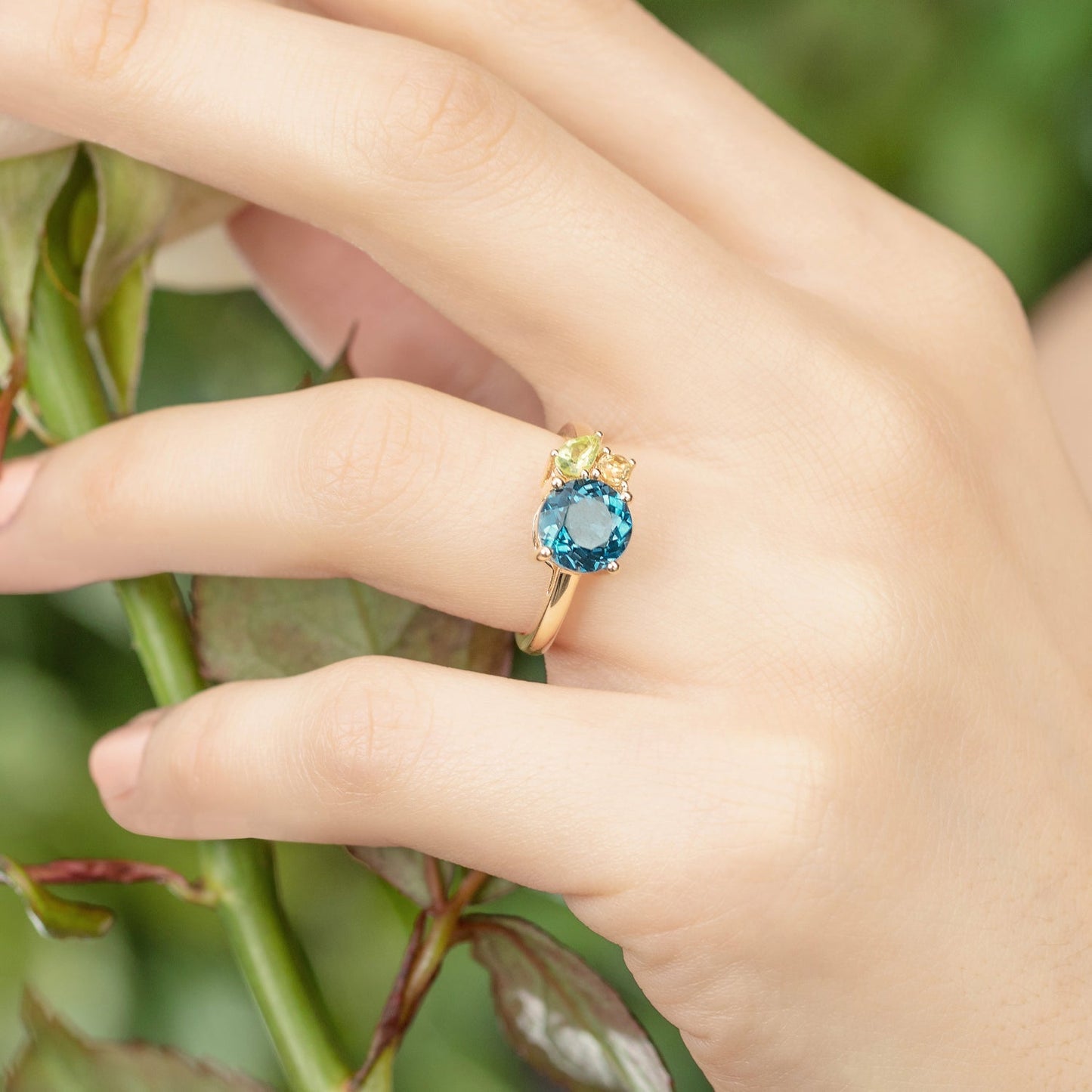 Model wearing Teal Topaz Gold Cluster Ring
