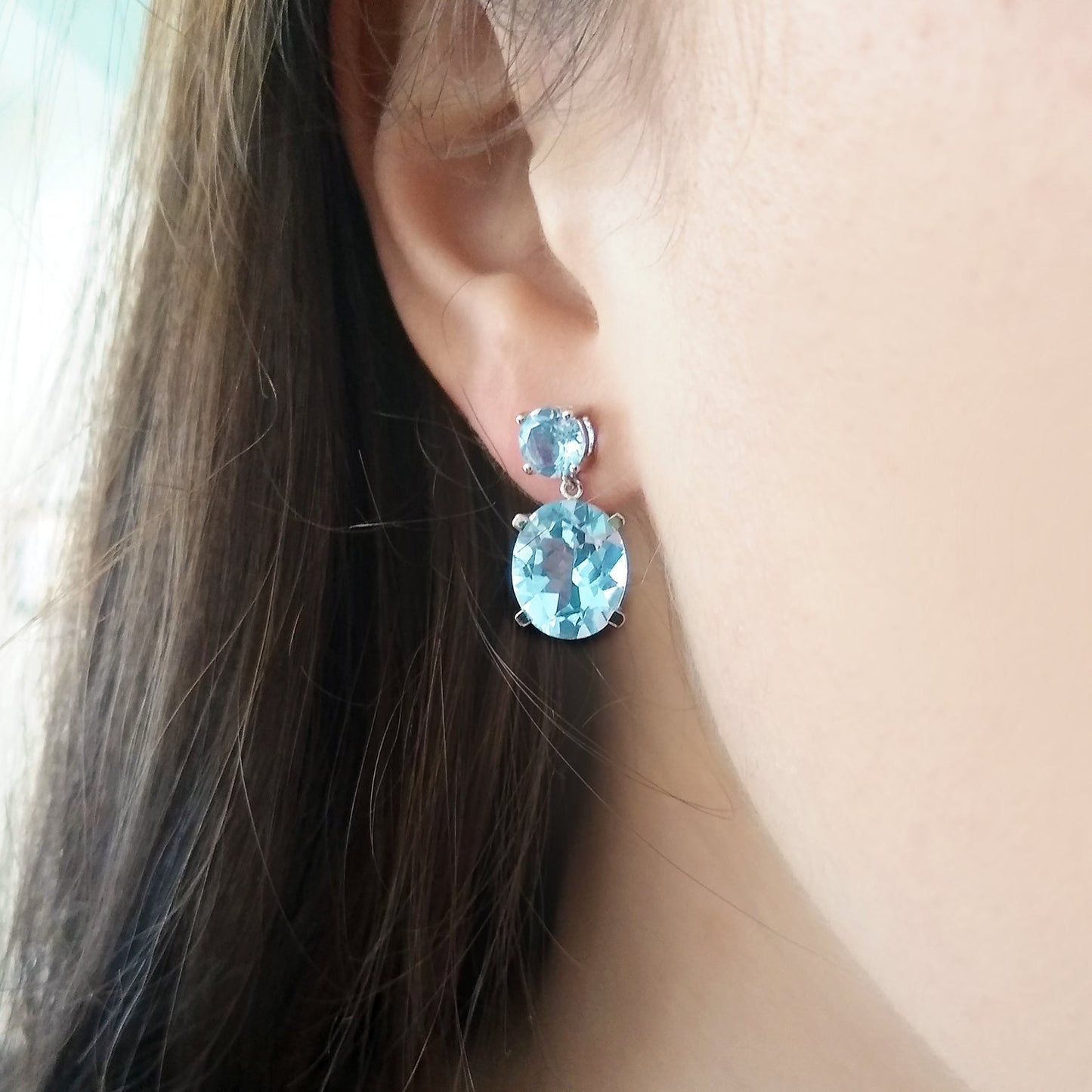 Model wearing Sterling Silver or White Gold Sky Blue Topaz Drop Earrings