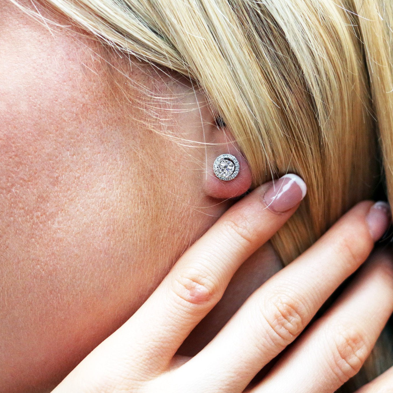 Model wearing 18ct White Gold Diamond Halo Studs
