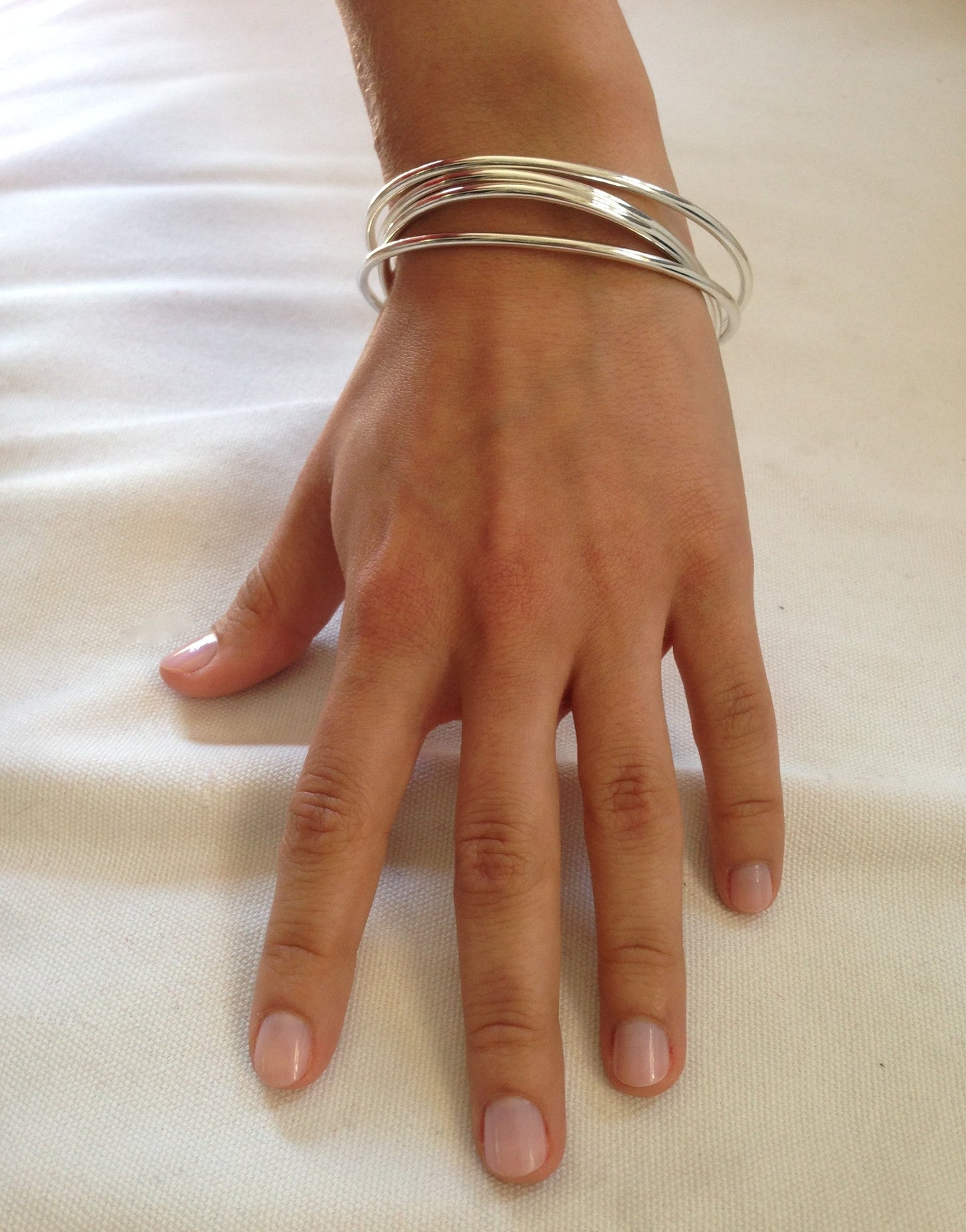 Model wearing Sterling Silver Bangle