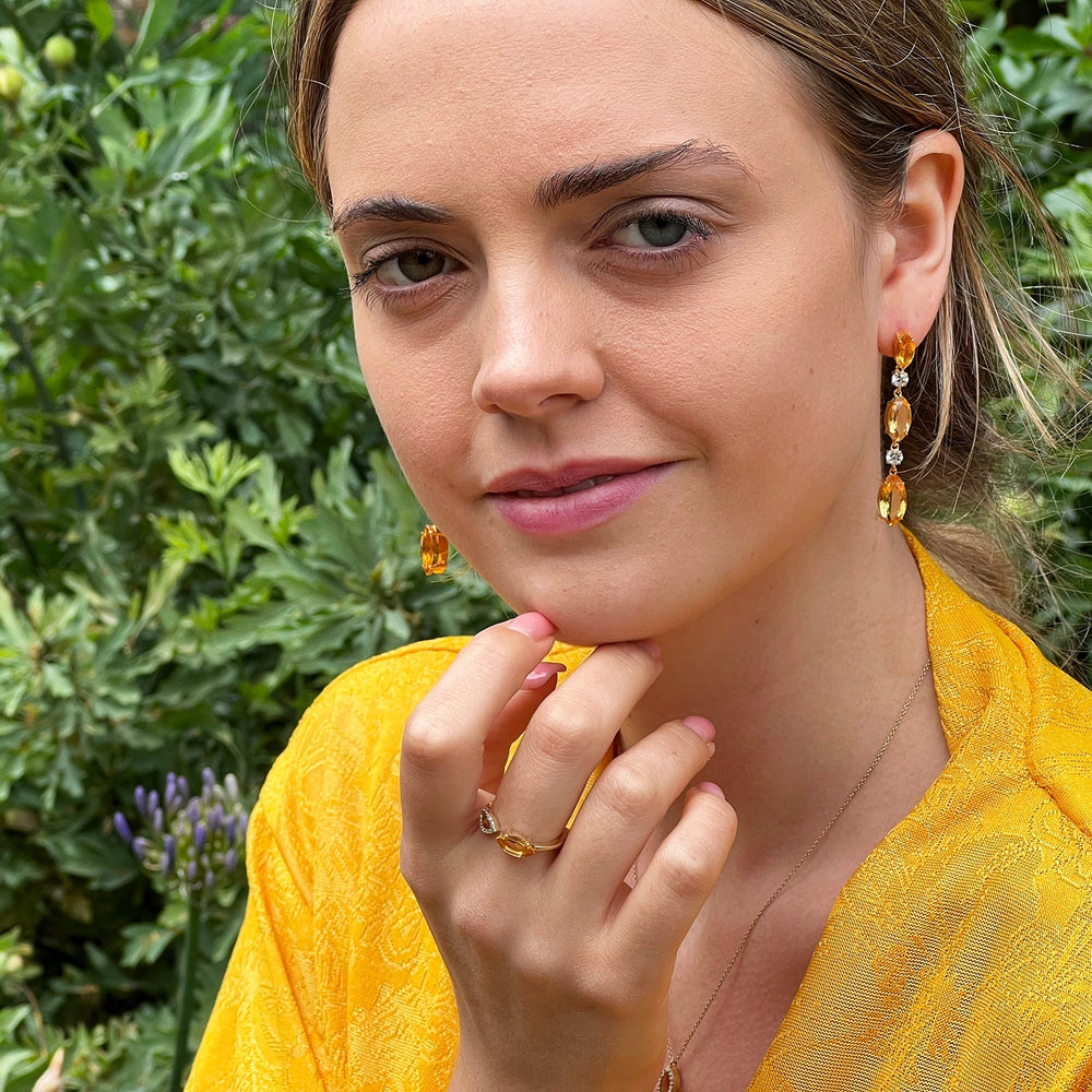 model wearing citrine and white topaz drop earrings