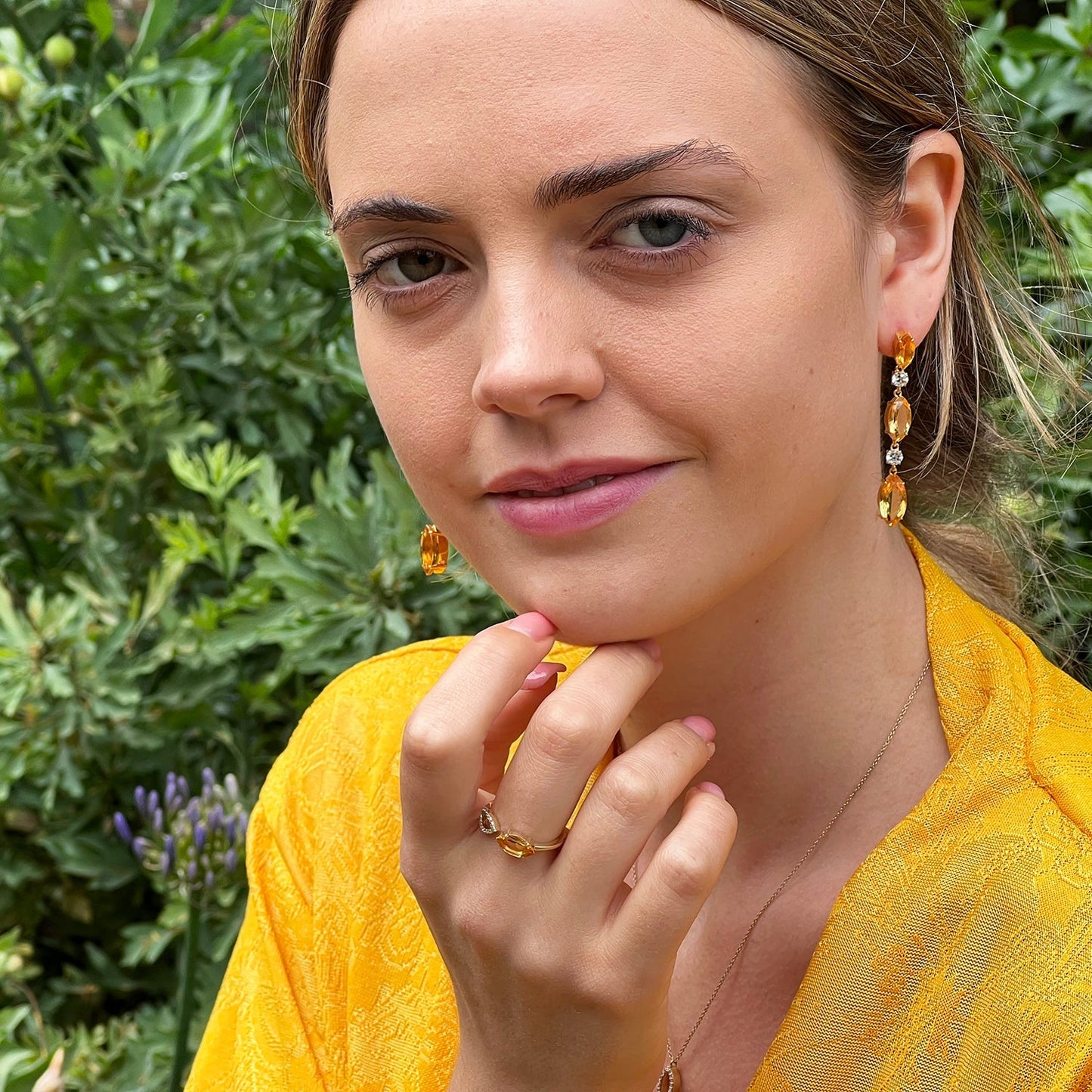model wearing citrine and white topaz drop earrings