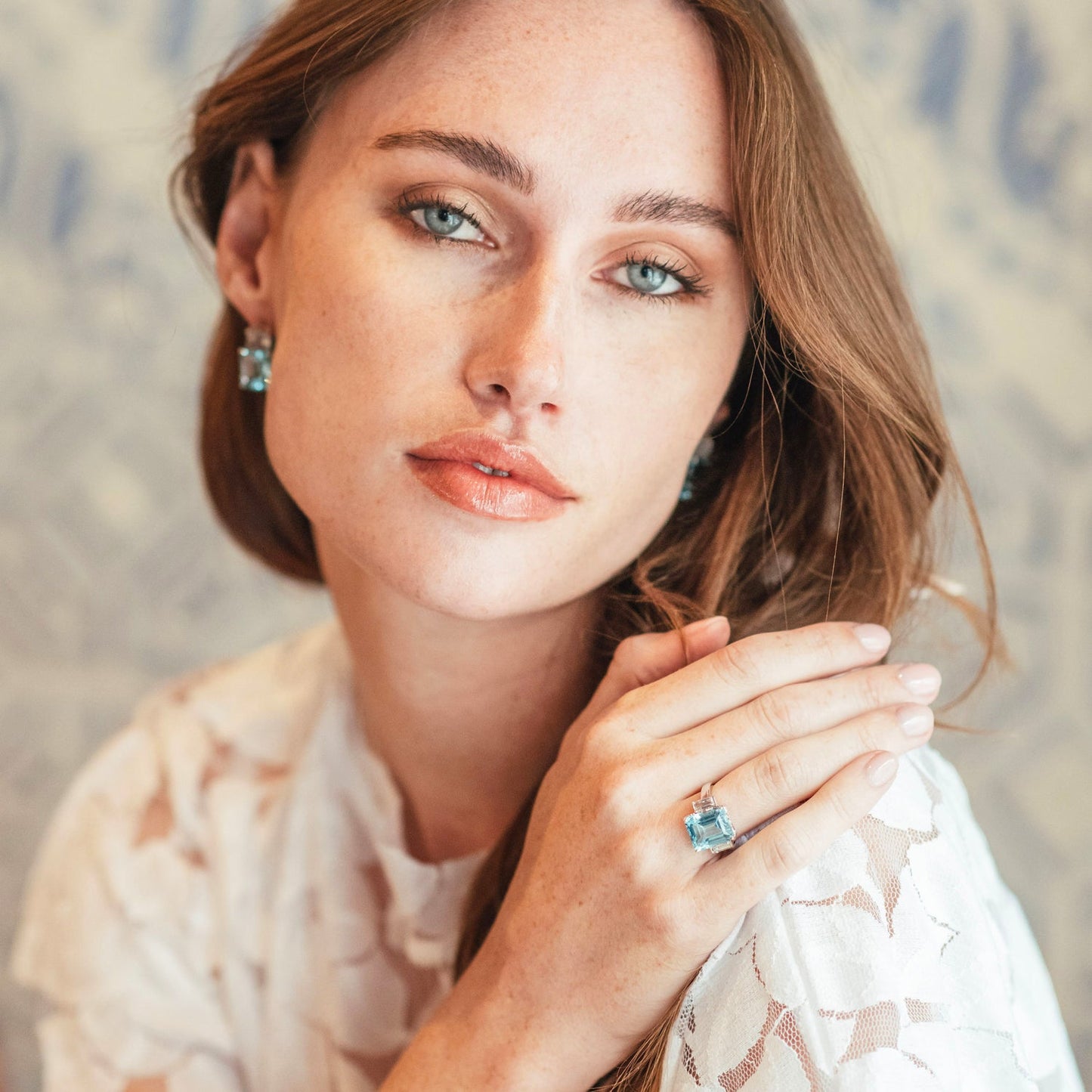 Model wearing Octagon White Gold Ring in White Topaz & Blue Topaz
