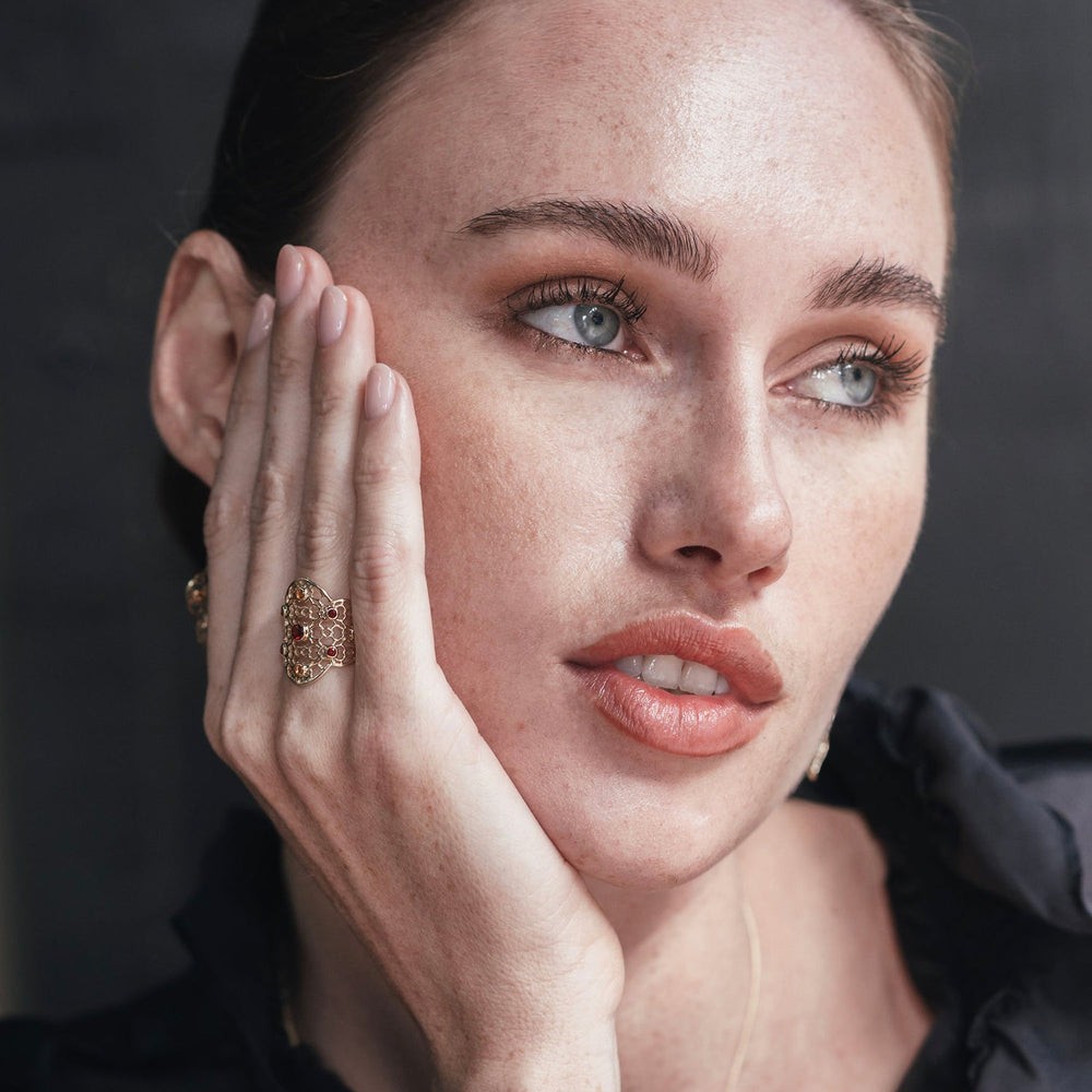 
                  
                    Model wearing Gold Filigree Ring in Garnet & Citrine
                  
                