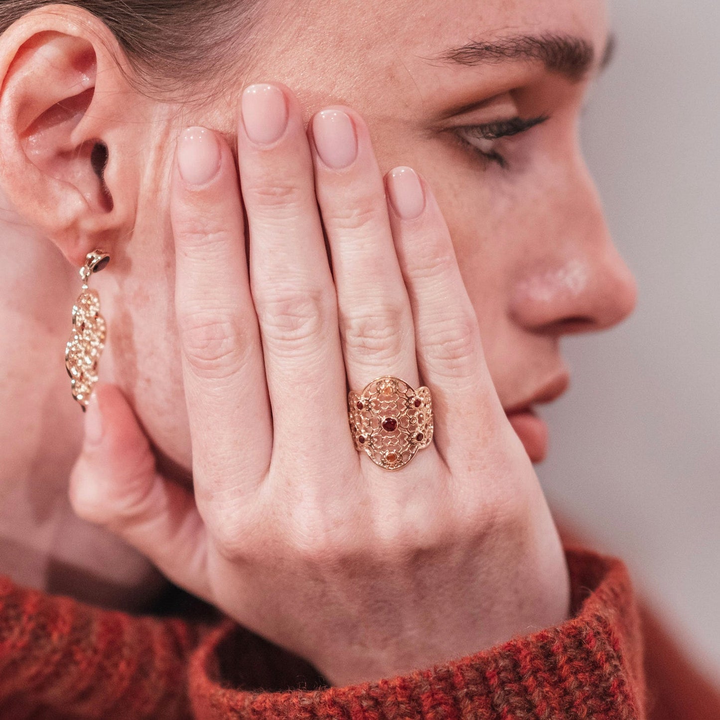 Model wearing Gold Filigree Ring in Garnet & Citrine