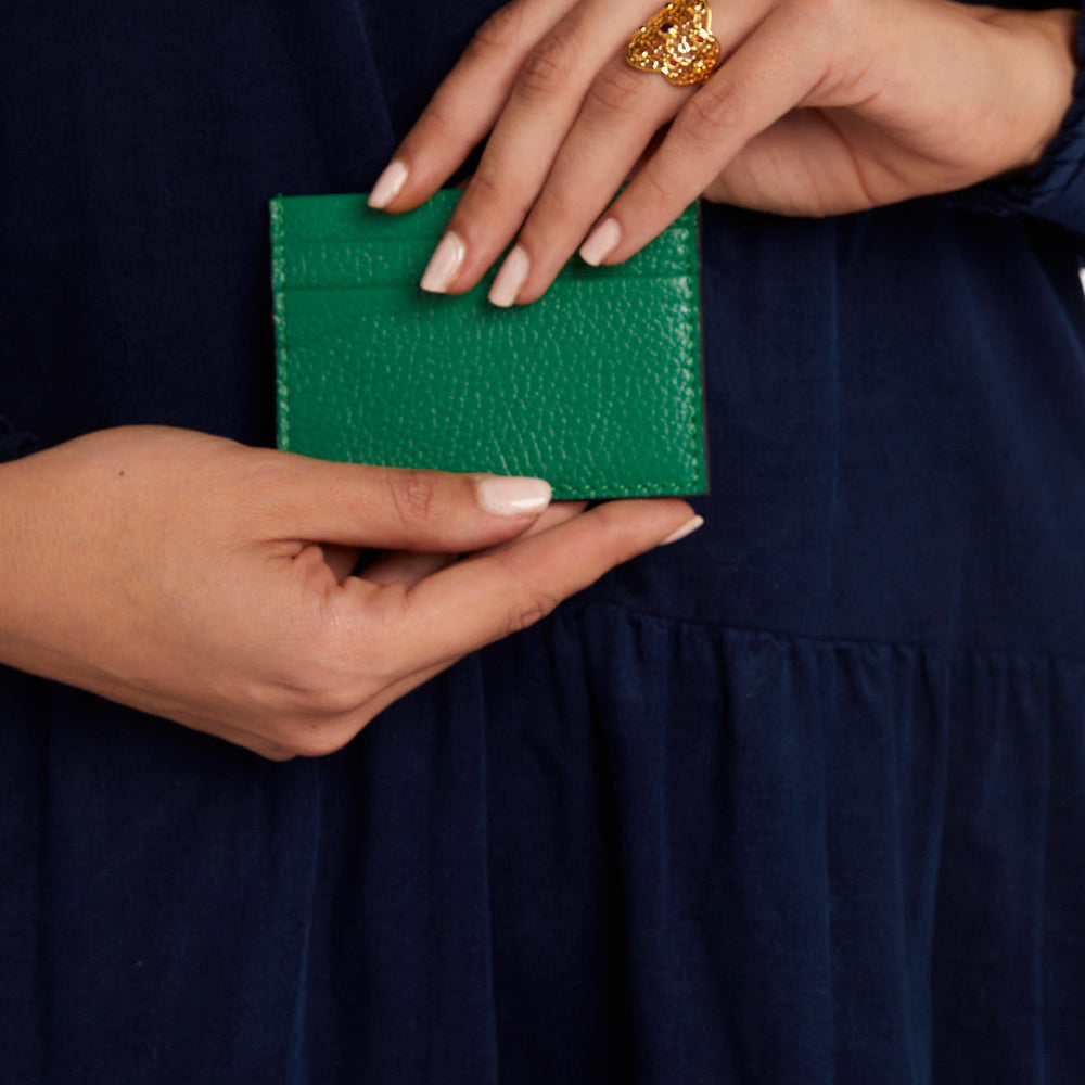 Model holding Green Credit Card Holder