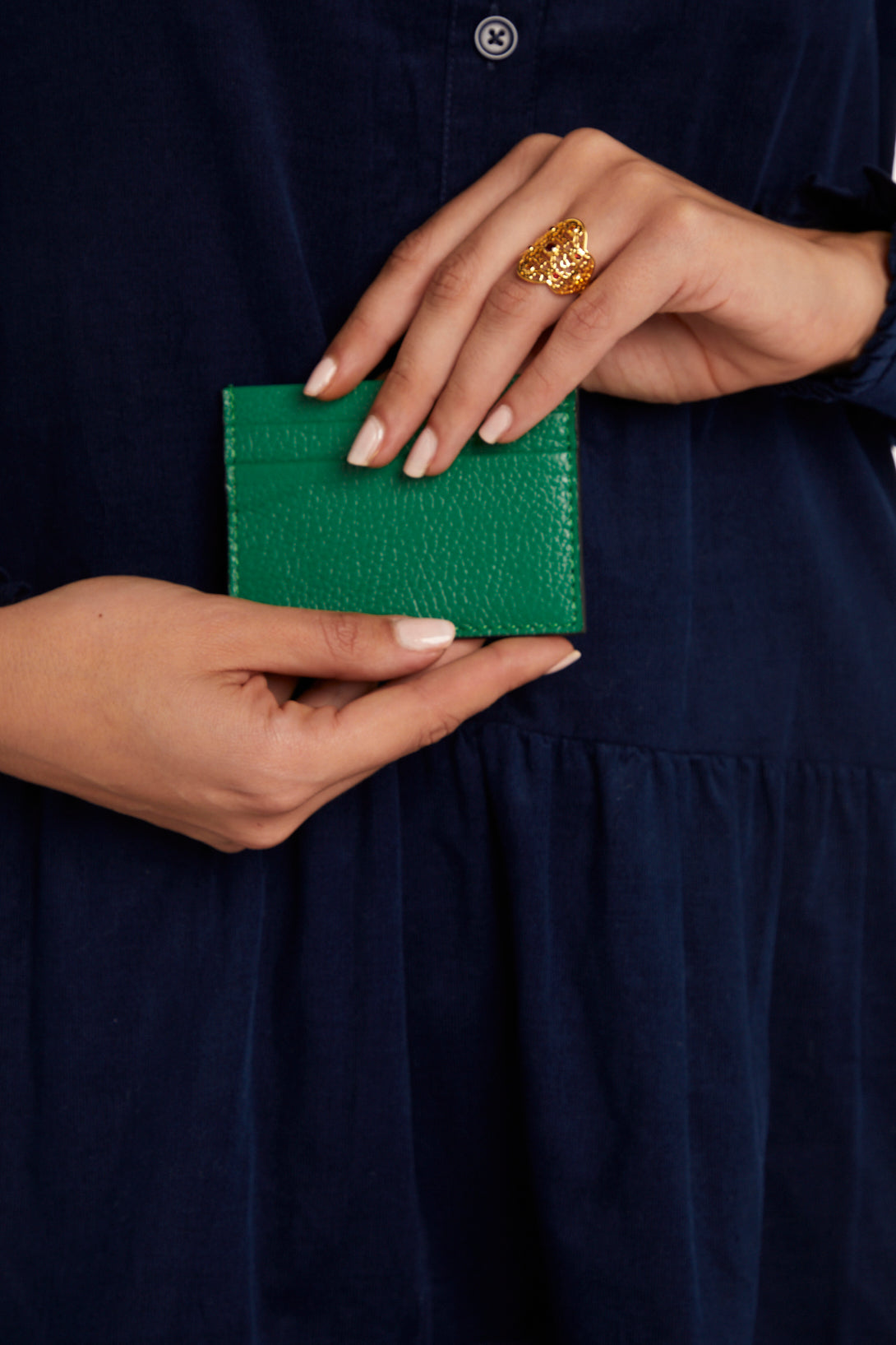 Model holding Green Credit Card Holder