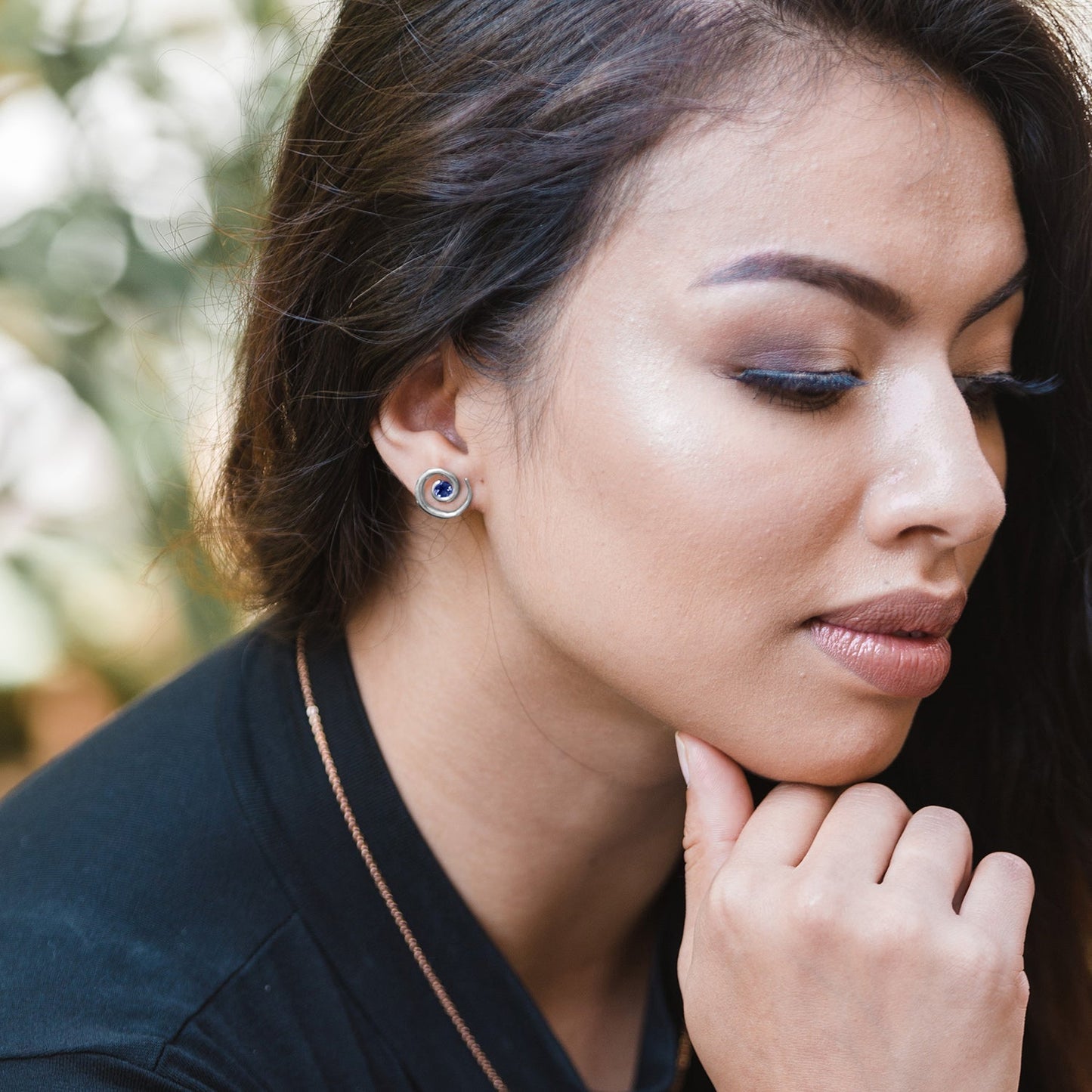 Model wearing Silver Sapphire Spiral Earrings 