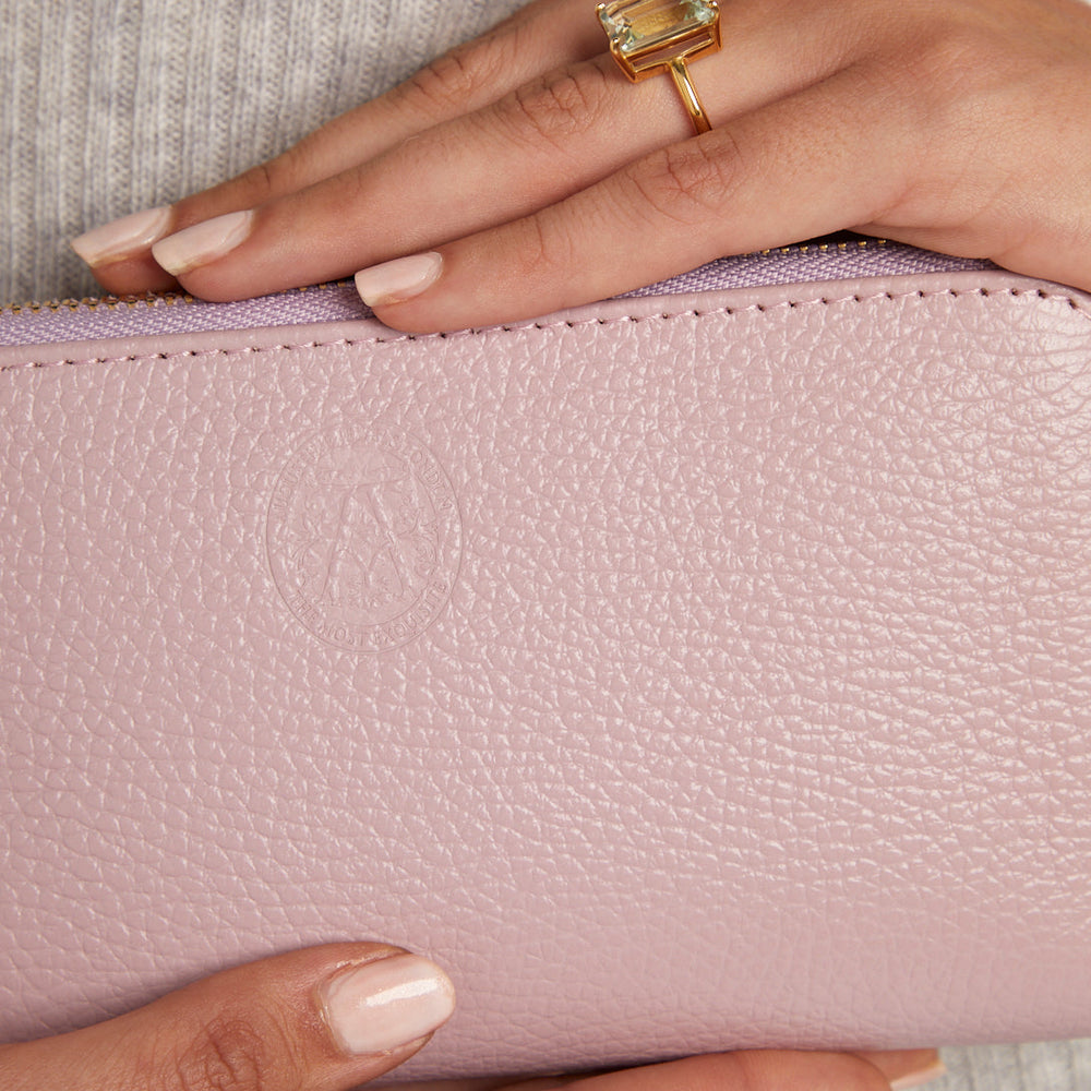 model holding pink purse