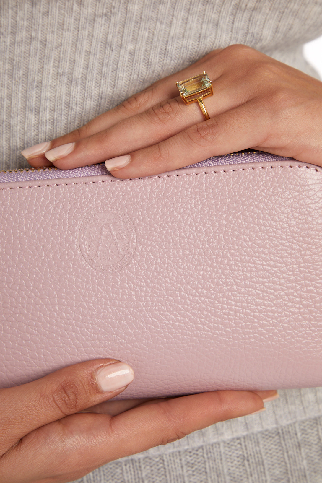 model holding pink purse