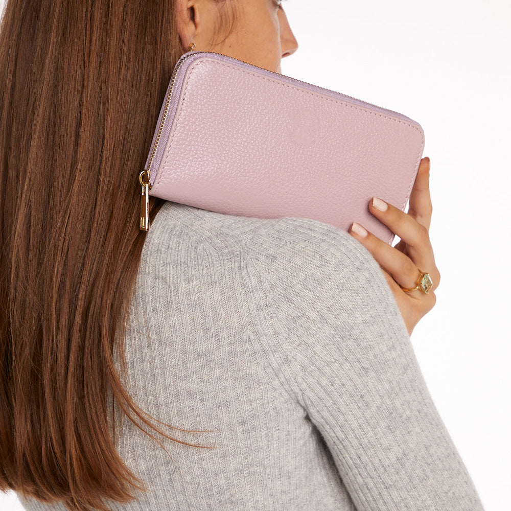 
                  
                    Model Holding Pink Purse
                  
                