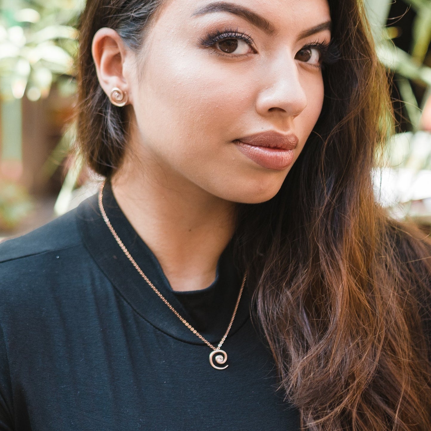 Model wearing rose gold vermeil spiral morganite necklace