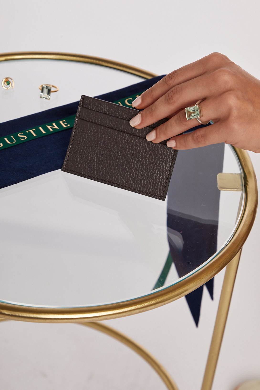 Model holding Brown Credit Card Holder