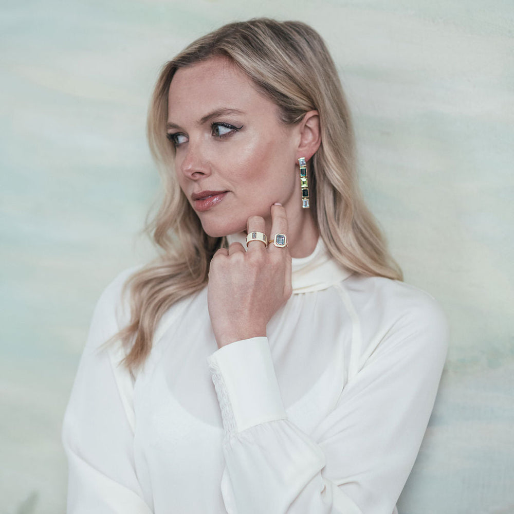 Model wearing Sky Blue Topaz, London Blue Topaz and Peridot 5 Drop Earrings