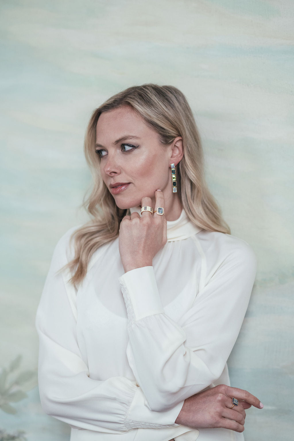 Model wearing Sky Blue Topaz, London Blue Topaz and Peridot 5 Drop Earrings