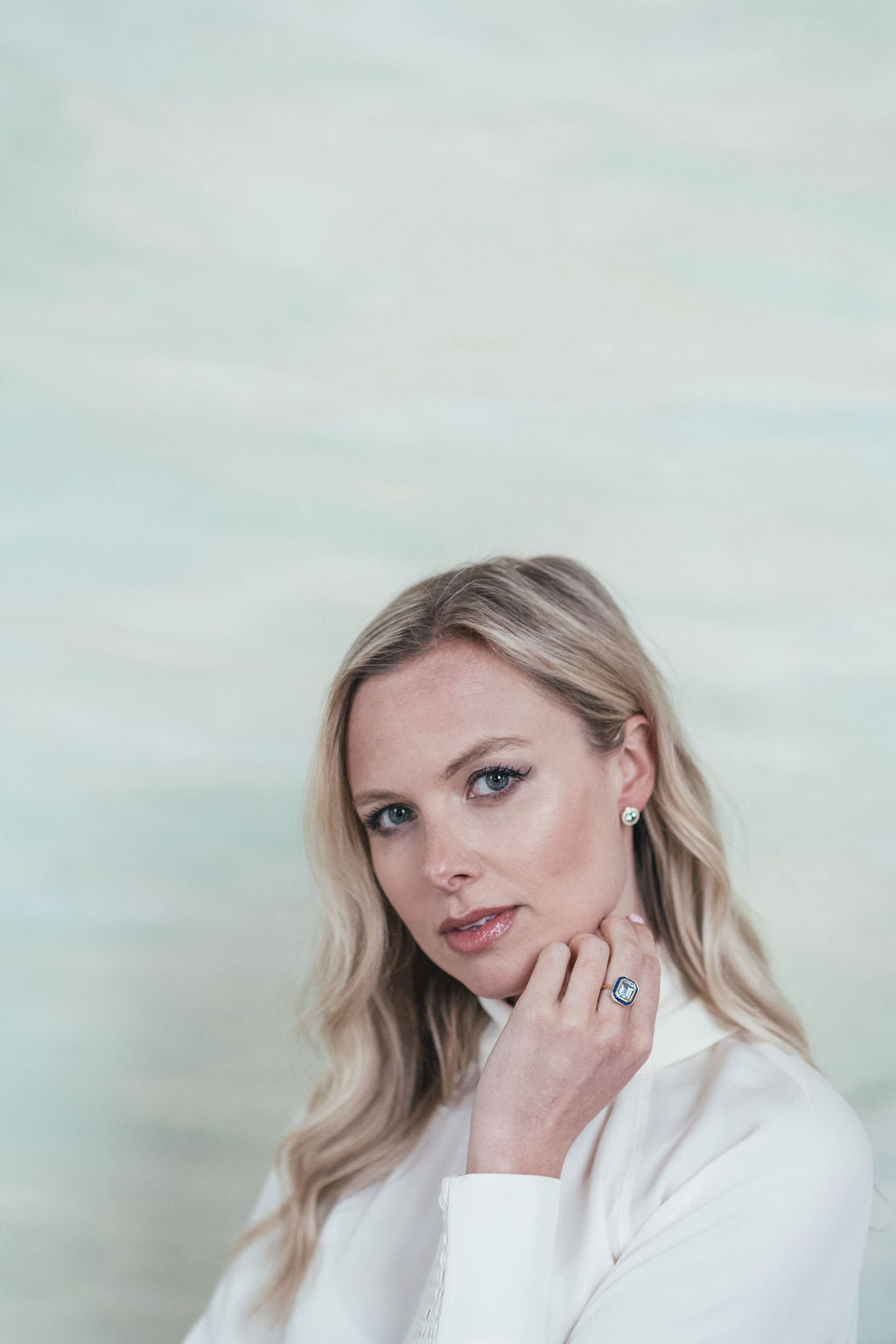 Model wearing Sky Blue Topaz and White Enamel Stud Earrings