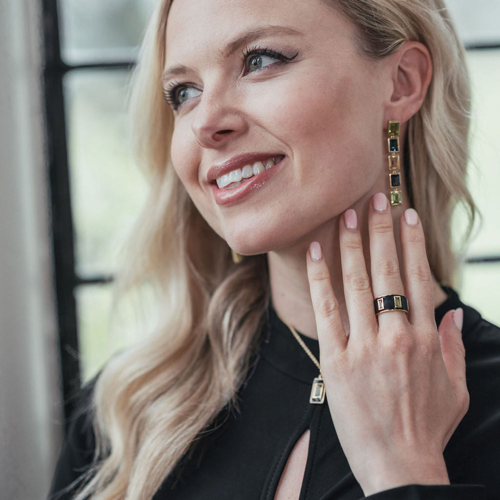 
                  
                    Model wearing Peridot and Navy Enamel Drum Ring
                  
                