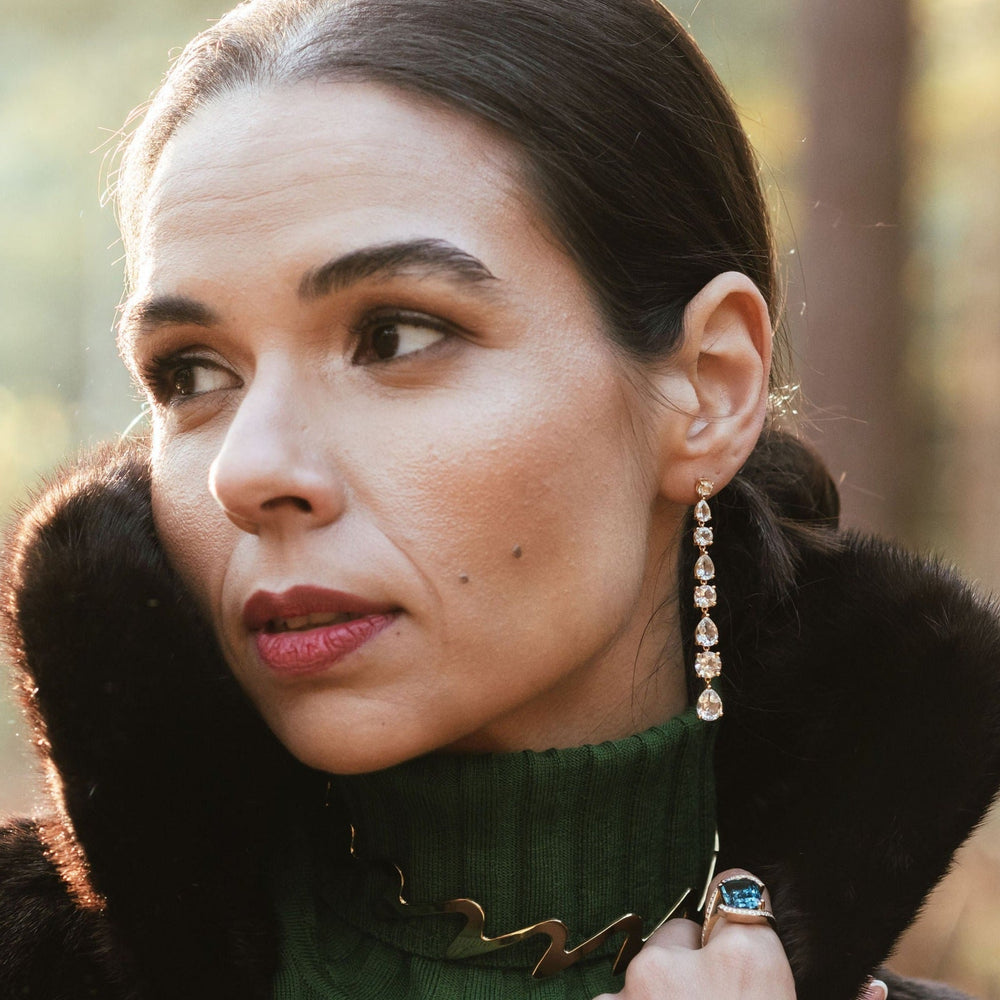 Model demonstrating the wear of the  Long Diamond 18ct Yellow Gold Drop Earrings