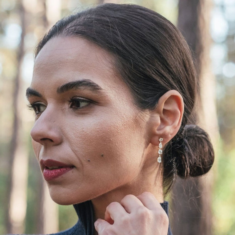 Model Wearing Short Diamond Earrings in 18ct Yellow Gold