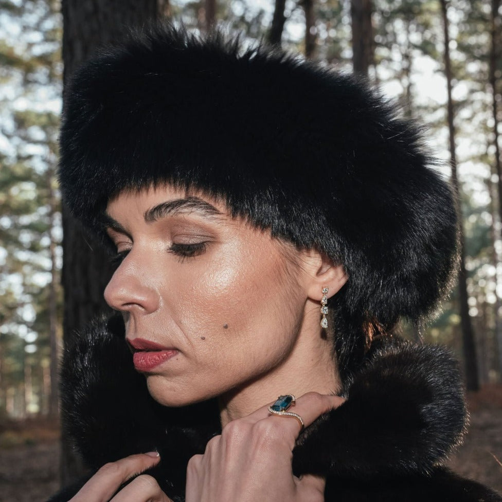 
                  
                    Model wearing short white topaz yellow gold drop earrings
                  
                