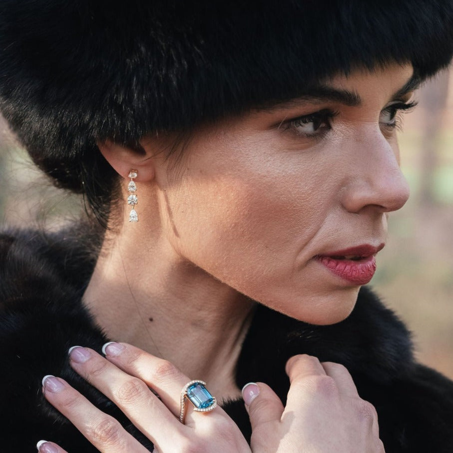 
                  
                    Model wearing short diamond earrings in 18ct yellow gold
                  
                