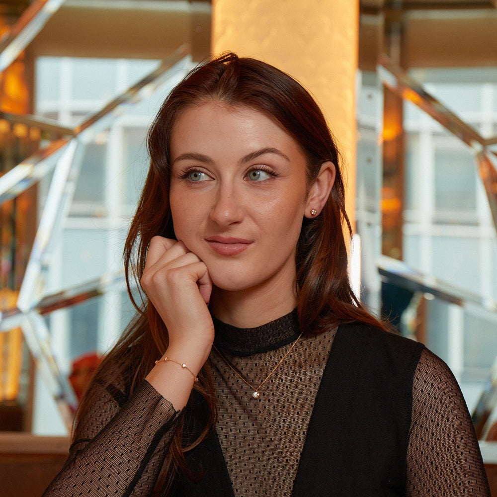 
                  
                    Model wearing New York Collection Delicate Round Shaped Gold Diamond Necklace Bezel Set with a 0.9ct round-cut diamond from Augustine Jewels
                  
                