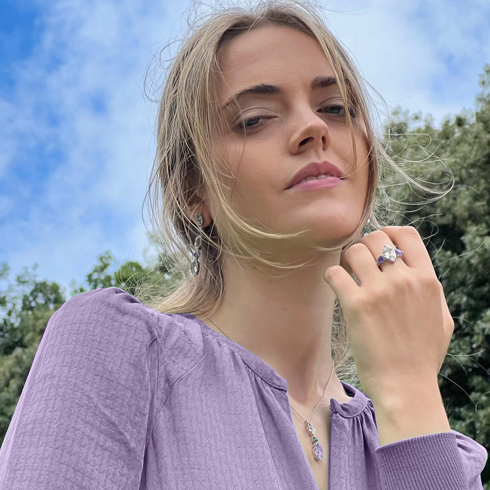 Model wearing White Topaz & Purple Amethyst Ring