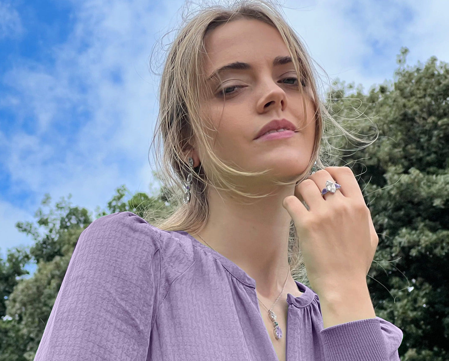 Model wearing White Topaz & Purple Amethyst Ring