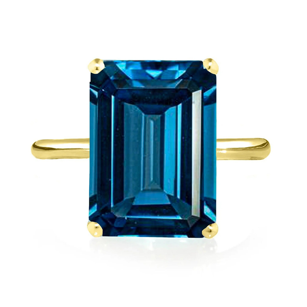 Yellow Gold Teal Topaz Cocktail Ring with yellow gold band and white background